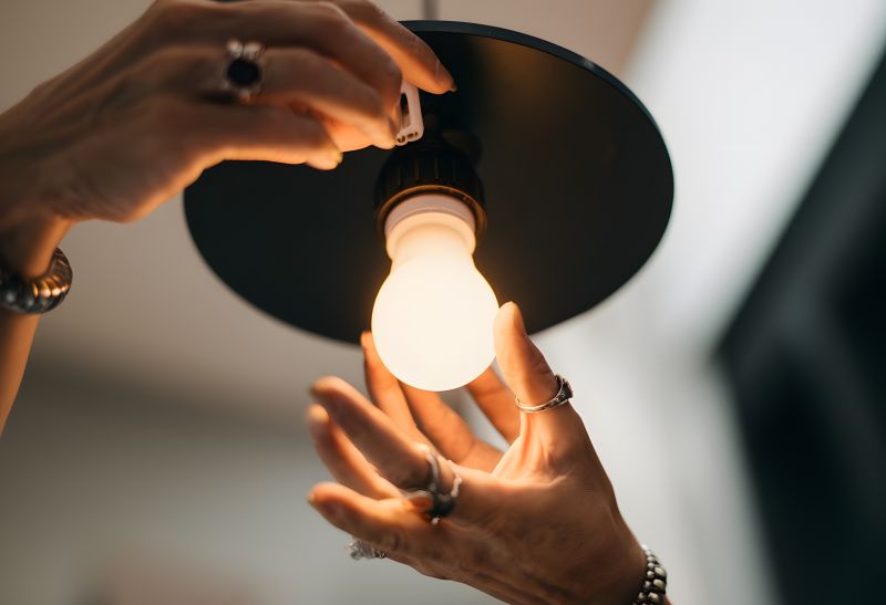 Handyman Fixing Light Fixture